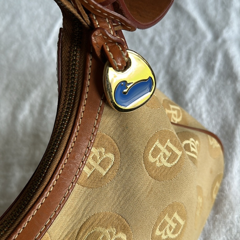 Dooney & Bourke Tan and Brown Shoulder Bag with leather adjustable strap.